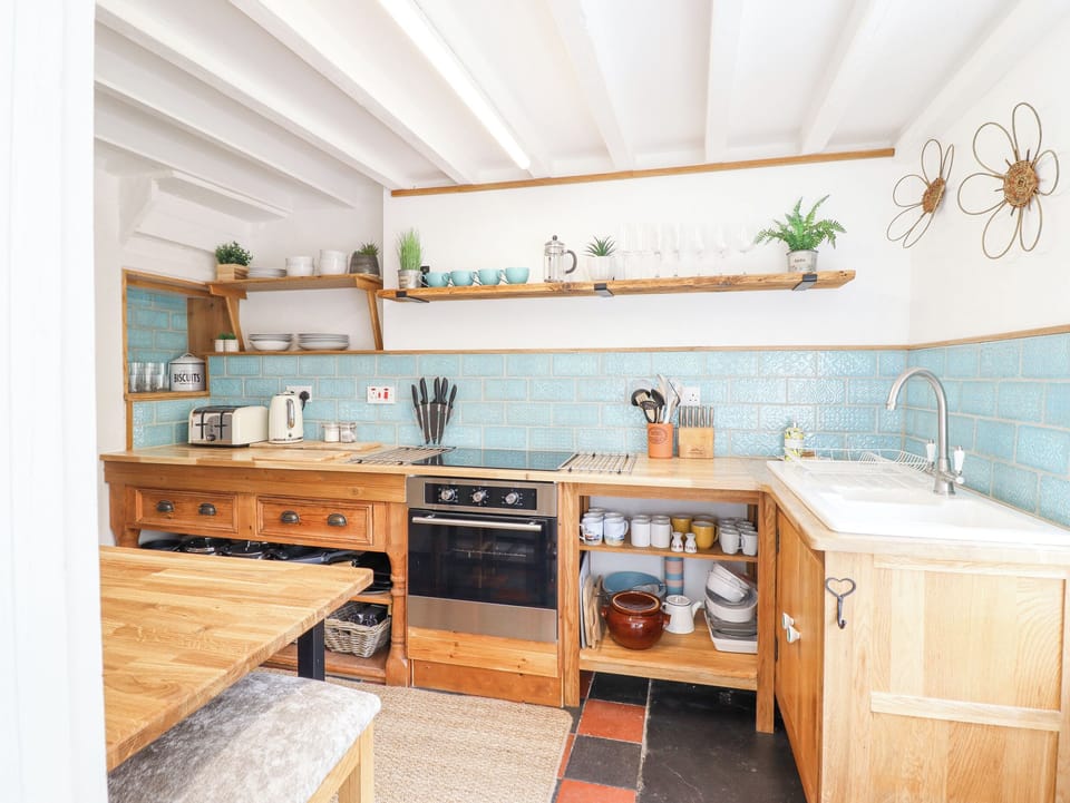 Fridge, electric kettle, toaster, cookware/dishes/utensils