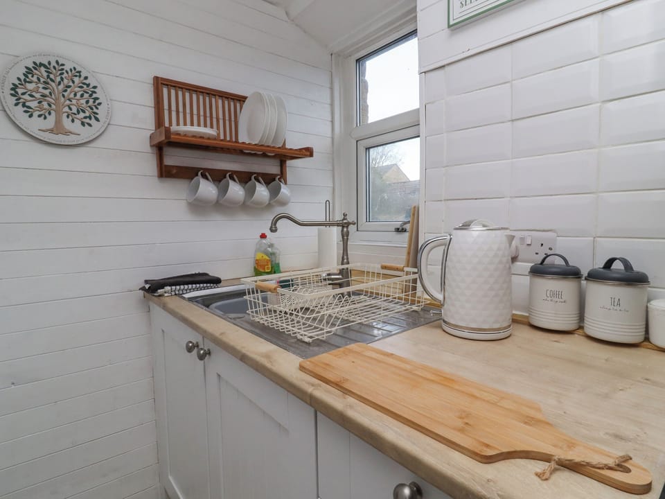 Fridge, electric kettle, toaster, cookware/dishes/utensils