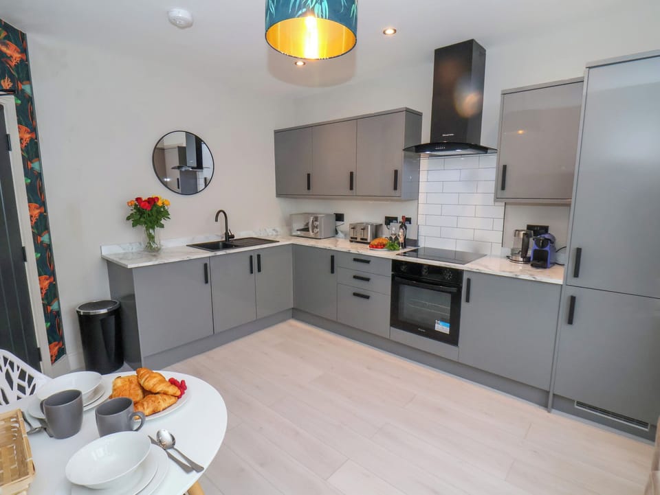 Fridge, electric kettle, toaster, cookware/dishes/utensils