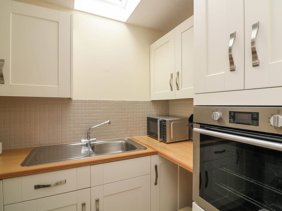 Fridge, electric kettle, toaster, cookware/dishes/utensils