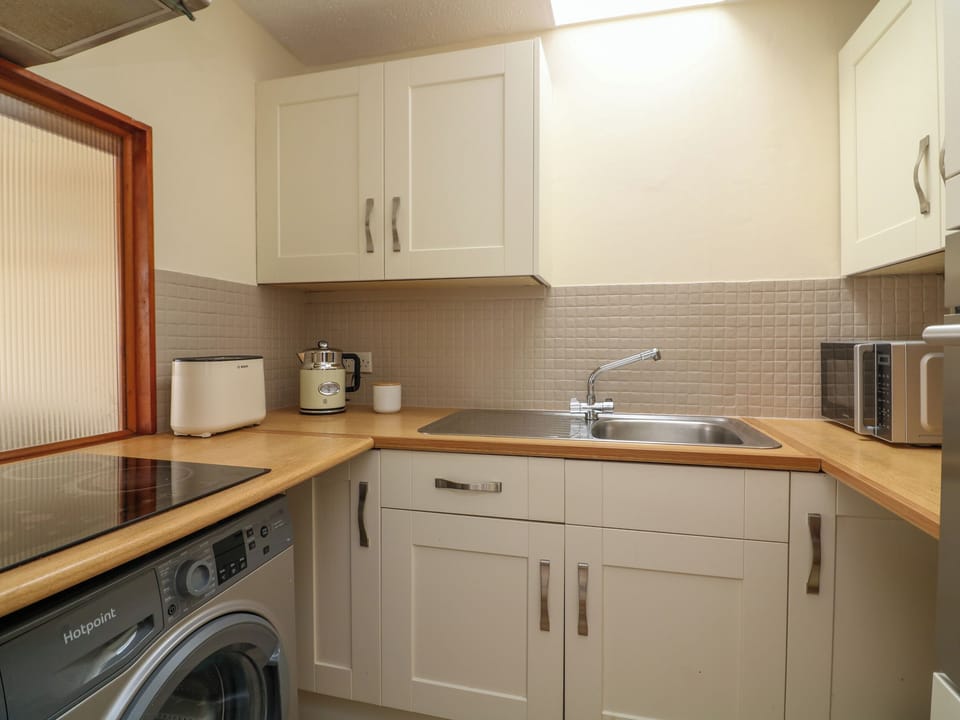 Fridge, electric kettle, toaster, cookware/dishes/utensils