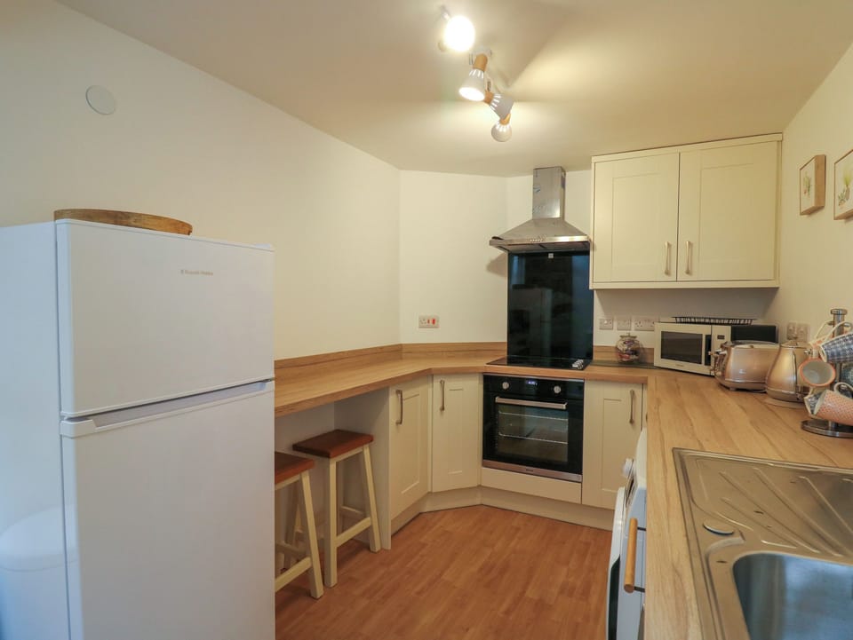 Fridge, electric kettle, toaster, cookware/dishes/utensils