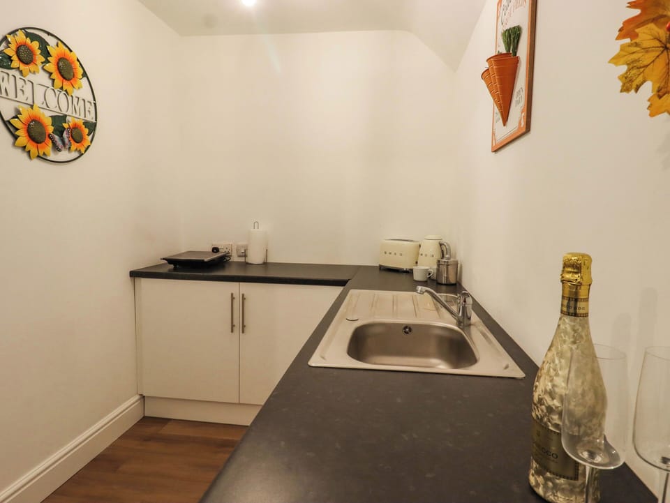 Fridge, electric kettle, toaster, cookware/dishes/utensils