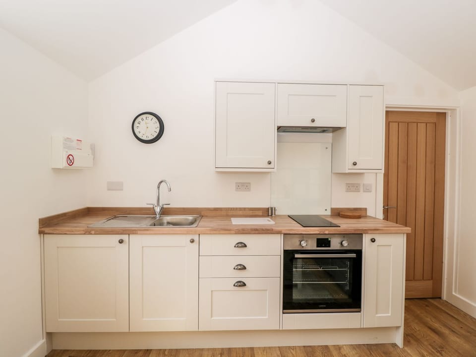 Fridge, electric kettle, toaster, cookware/dishes/utensils
