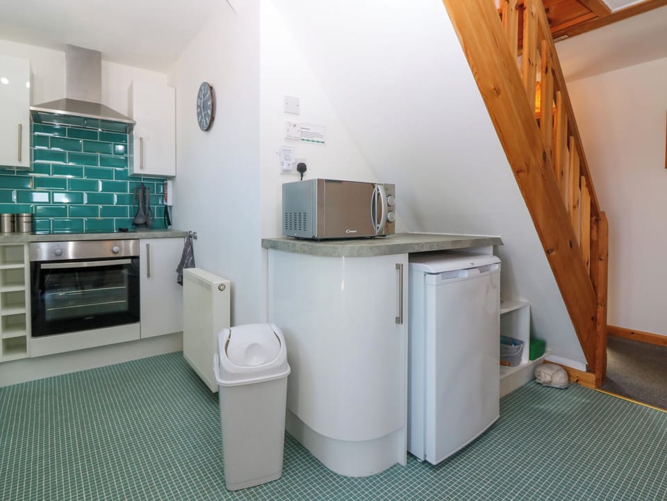 Fridge, electric kettle, toaster, cookware/dishes/utensils