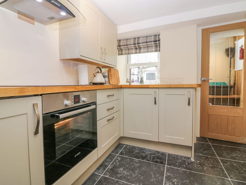 Fridge, electric kettle, cookware/dishes/utensils