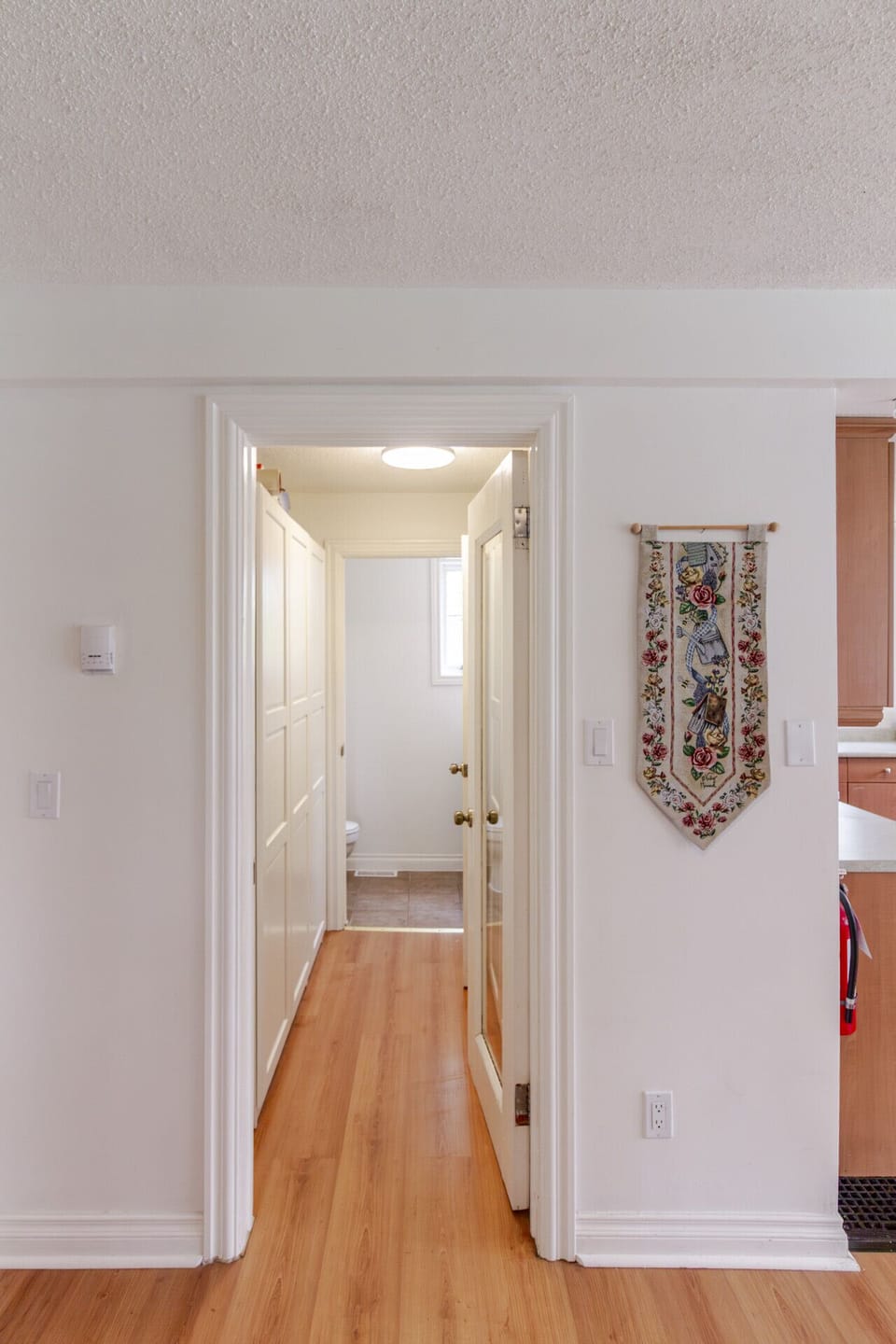 hallway with lots of cupboards for anything you`d like to tuck away