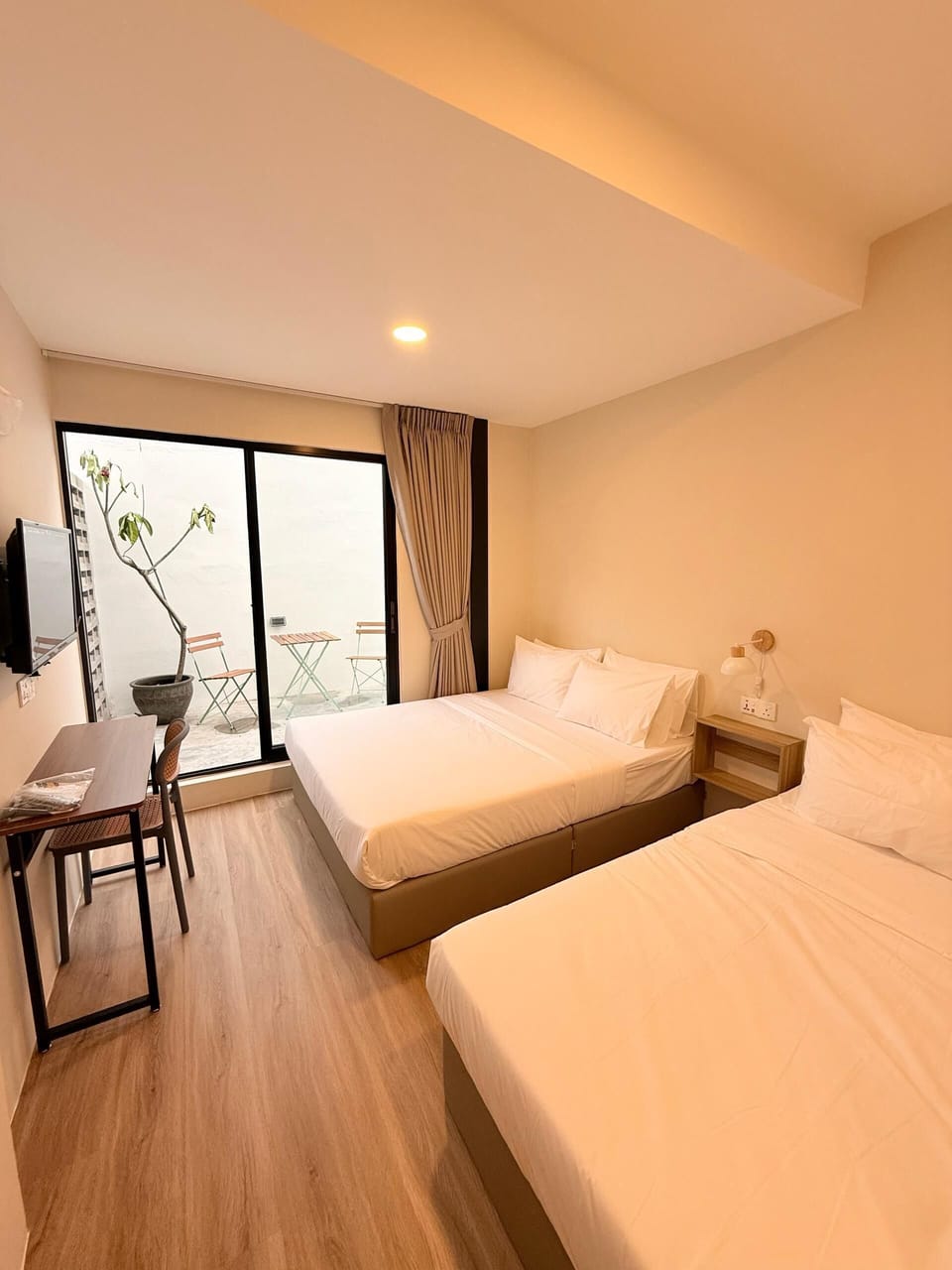 Superior Quadruple Room, Patio, Courtyard View | Laptop workspace, blackout drapes, soundproofing