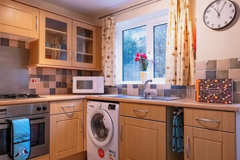 Fully equipped kitchen leading to the garden. 