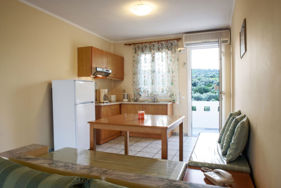 Apartment, Sea View (For 2) | Private kitchen | Full-size fridge, stovetop, coffee/tea maker, electric kettle