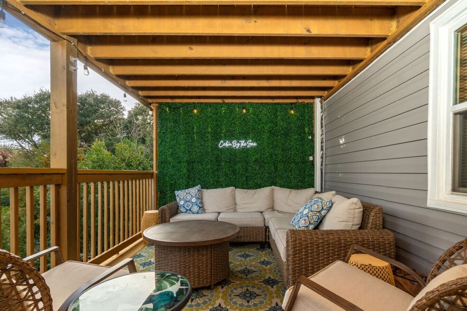 Unwind on plush outdoor couches in our serene cabin setting