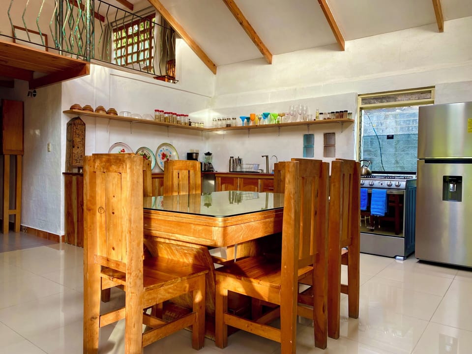 Livingroom with dinning table. You can see the second story as well.
