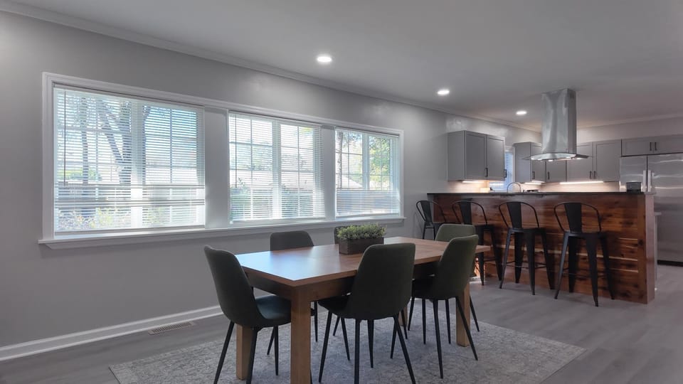 Modern kitchen with dining table for seating up to 8