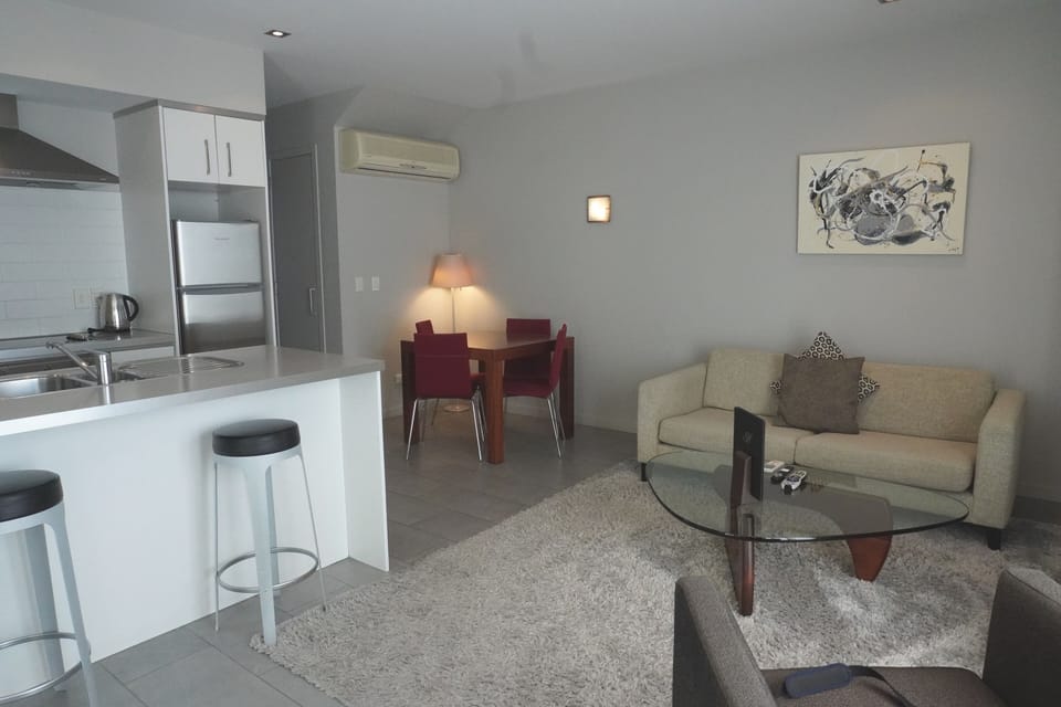 Deluxe Apartment, 1 Bedroom, Pool View | Living area | Flat-screen TV