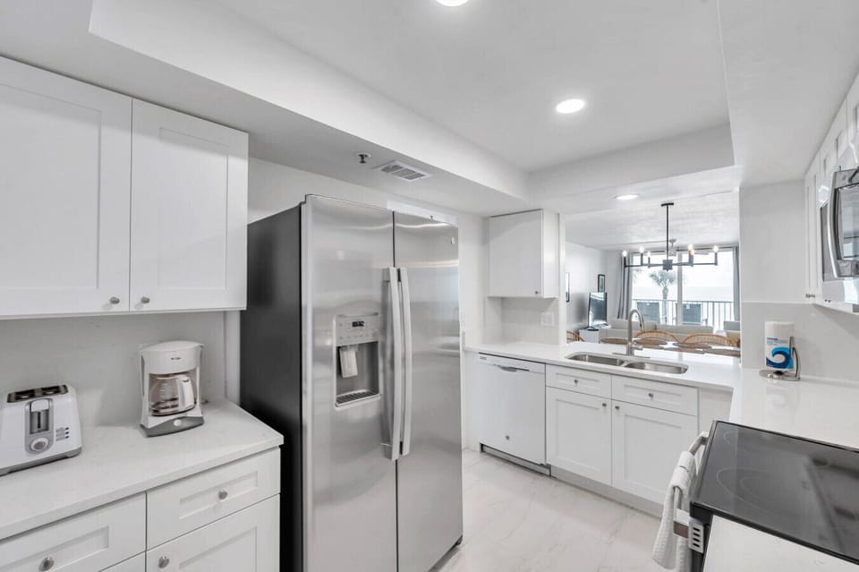 Clean, modern kitchen w/ stainless steel appliances and plenty of prep space.