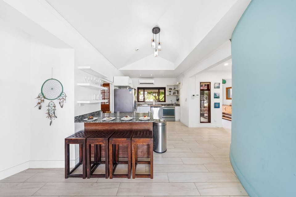 A bright, stylish dining space with modern decor, cozy seating, and warm lighting—perfect for relaxed meals.