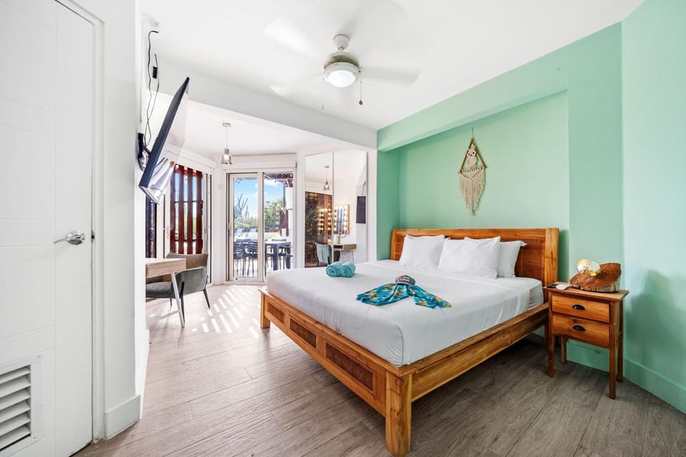 A serene retreat featuring a plush king bed and a private hot tub—perfect for indulgent relaxation and romantic escapes.