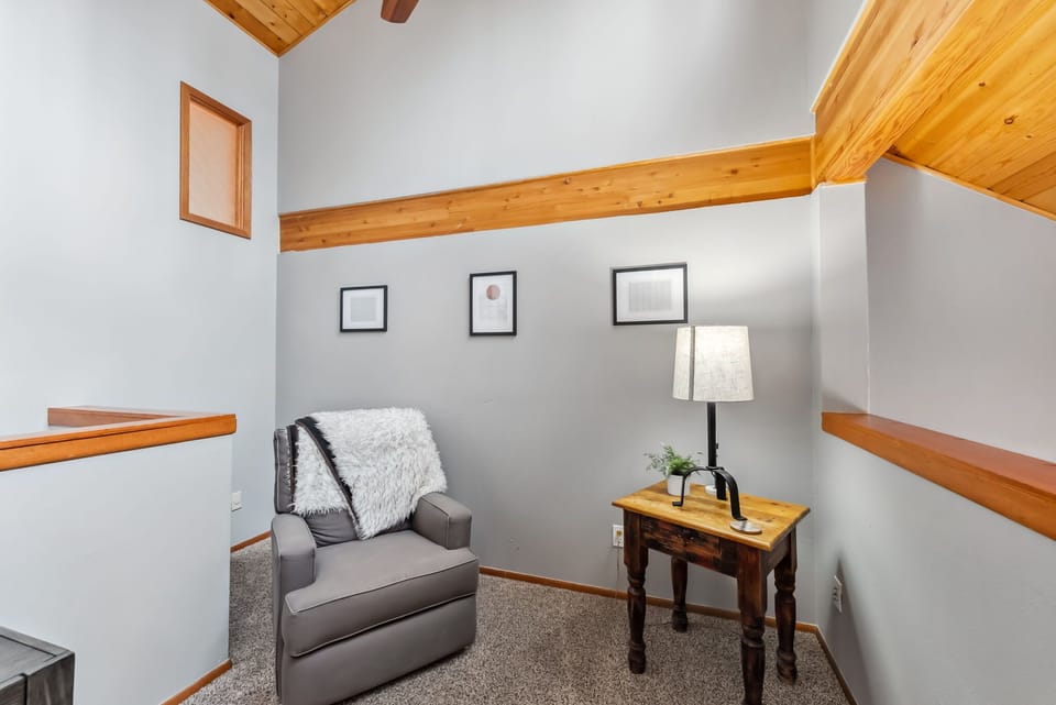 Loft area: Upper floor, dedicated workspace (desk, chair, monitor, keyboard and mouse)