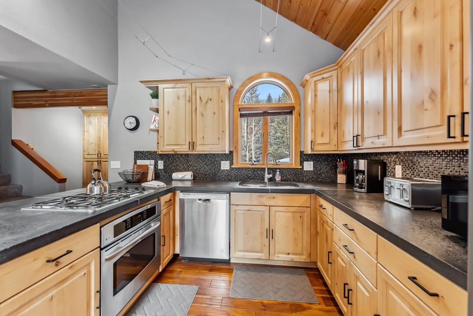 Kitchen: Main floor, drip coffee maker, Keurig, toaster, cooking utensils, tableware