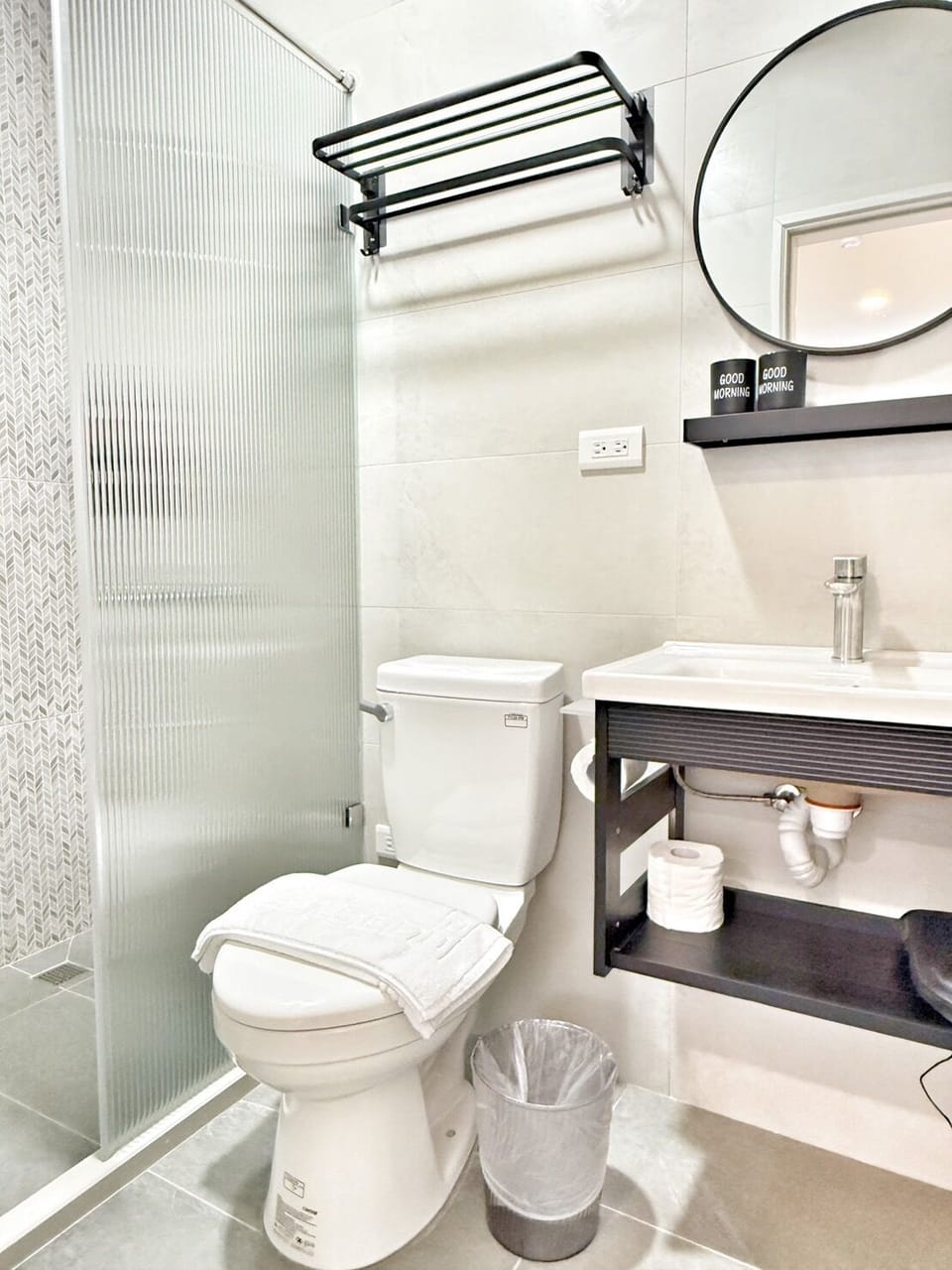 Shower, hair dryer, towels, shampoo