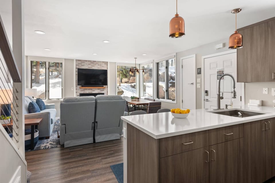 Enjoy the tv and living room while cooking or preparing meals in the kitchen