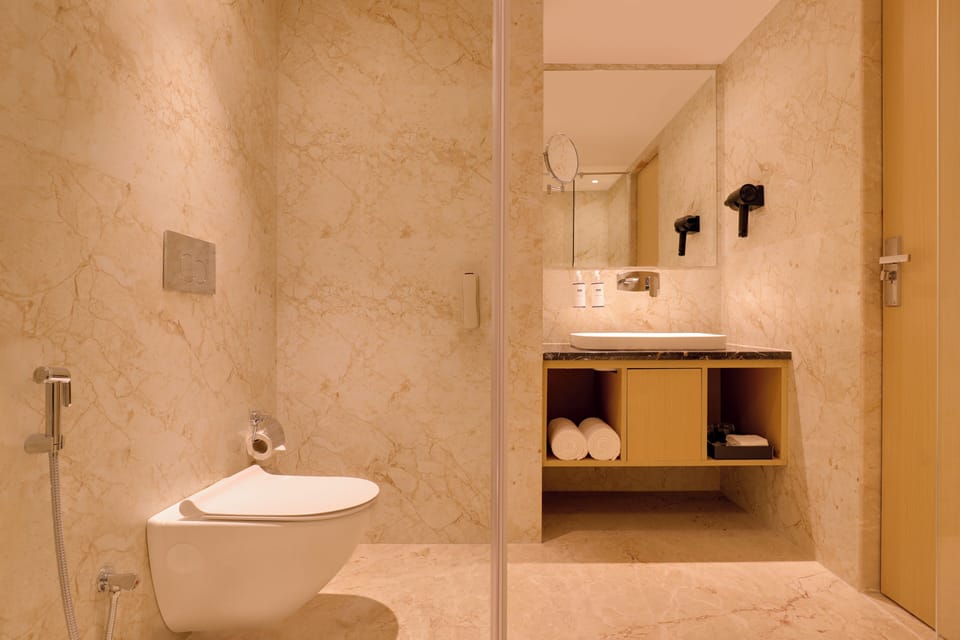 Studio Room | Bathroom | Shower, slippers, towels, soap
