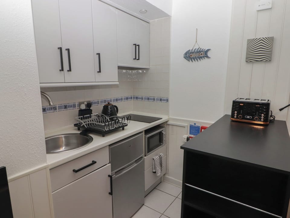 Fridge, electric kettle, toaster, cookware/dishes/utensils