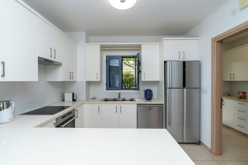 Deluxe Villa, Partial Sea View | Private kitchen | Espresso maker, coffee/tea maker, electric kettle, dining table