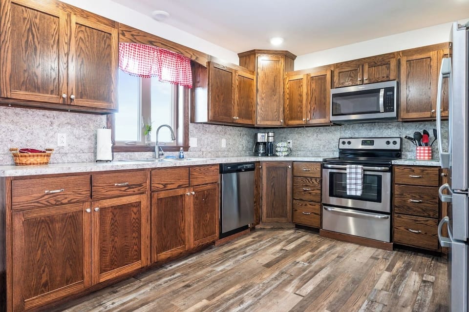 A blend of modern convenience and classic charm with stainless steel appliances and custom wood cabinets. Cook in style!
