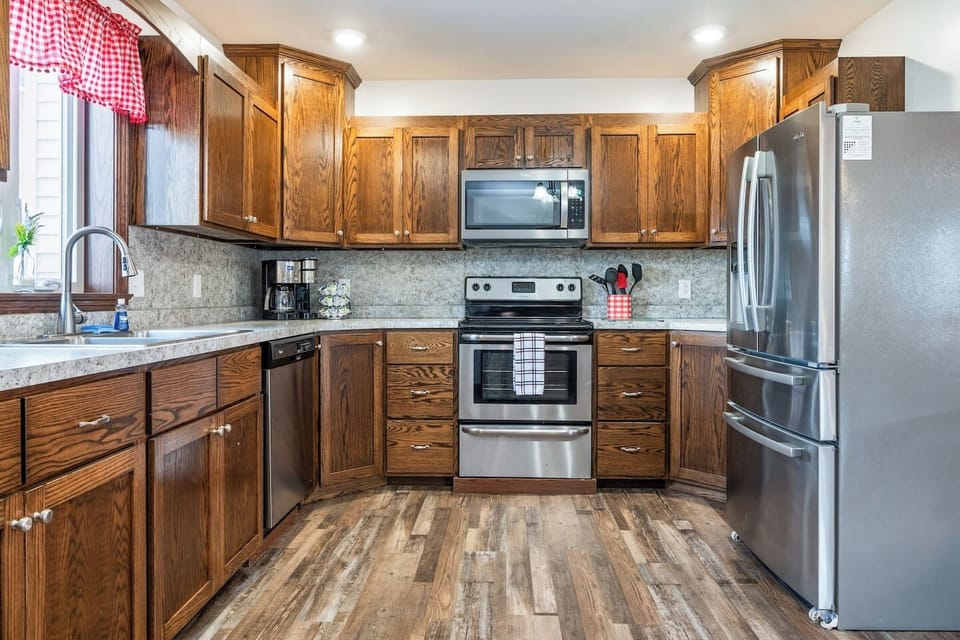 Whip up a feast in this bright and airy kitchen, complete with high-end appliances and charming country accents.