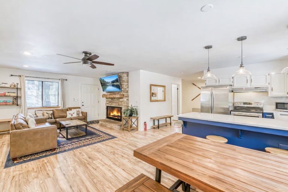 The kitchen is open to the dining area. It is a great space to visit while preparing meals.
