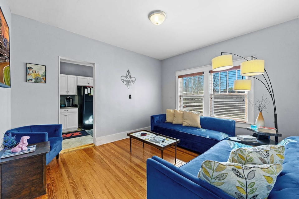Living Room - Soft lighting, plush seating, and warm vibes—welcome to your home away from home!