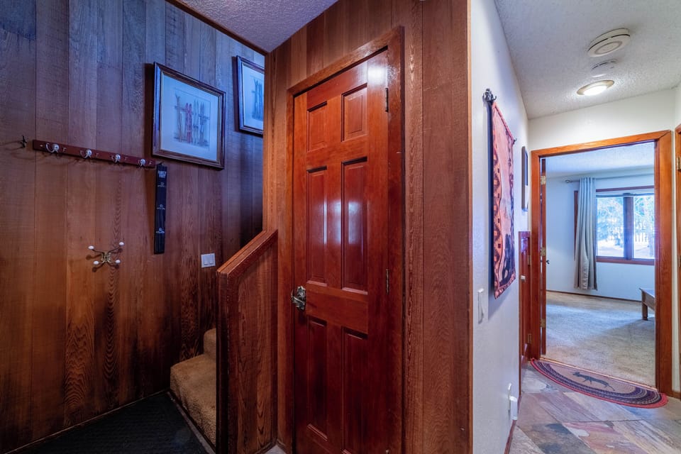Entryway with closet for ski/gear storage.