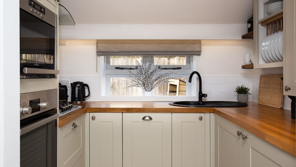 The compact, charming kitchen is packed with everything you need for a little culinary magic.