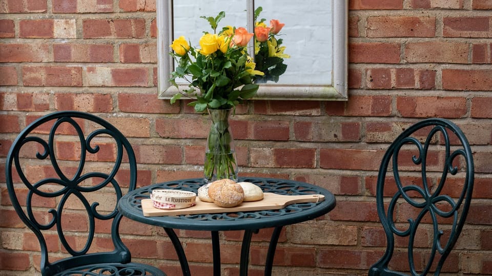The pretty alfrresco dining area is perfect for a glass of wine