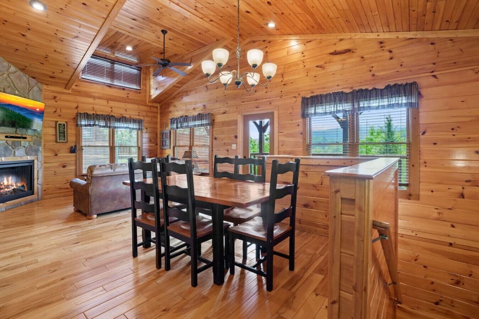 The main floor living room includes plenty of seating and a dining table that seats up to 6.