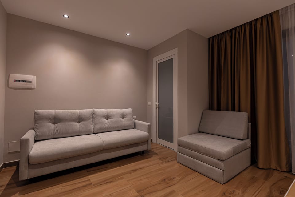 Deluxe Quadruple Room, Ground Floor | Desk, soundproofing, free WiFi