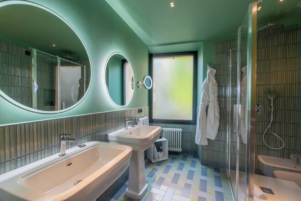 Junior Suite, Terrace, Lake View | Bathroom | Shower, rainfall showerhead, hair dryer, bathrobes