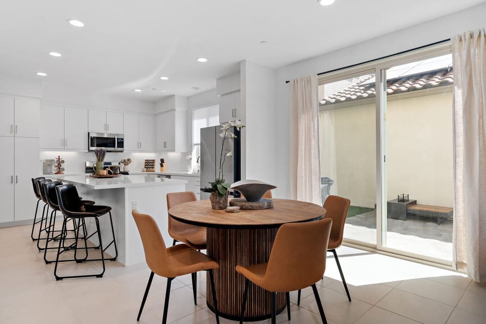 Open dining area flowing into the kitchen, perfect for easy group meals