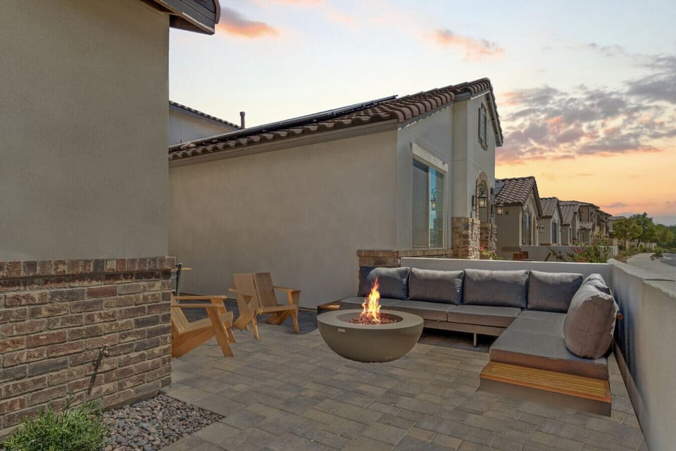 Cozy patio fire pit w/ cushioned seating, perfect for relaxed evenings outside