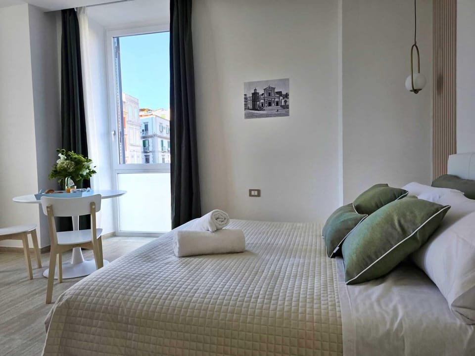 Exclusive Triple Room, Partial Sea View | Minibar, in-room safe, laptop workspace, soundproofing