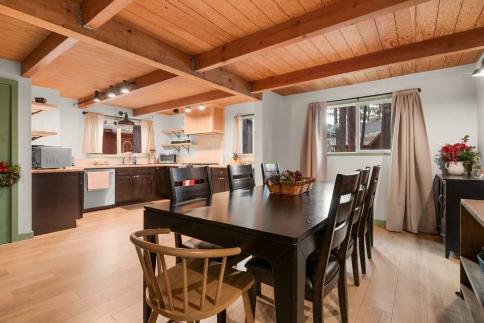Cook and dine in style in our warm and welcoming kitchen, where rustic wooden beams and a spacious dining table invite shared moments and culinary creativity.