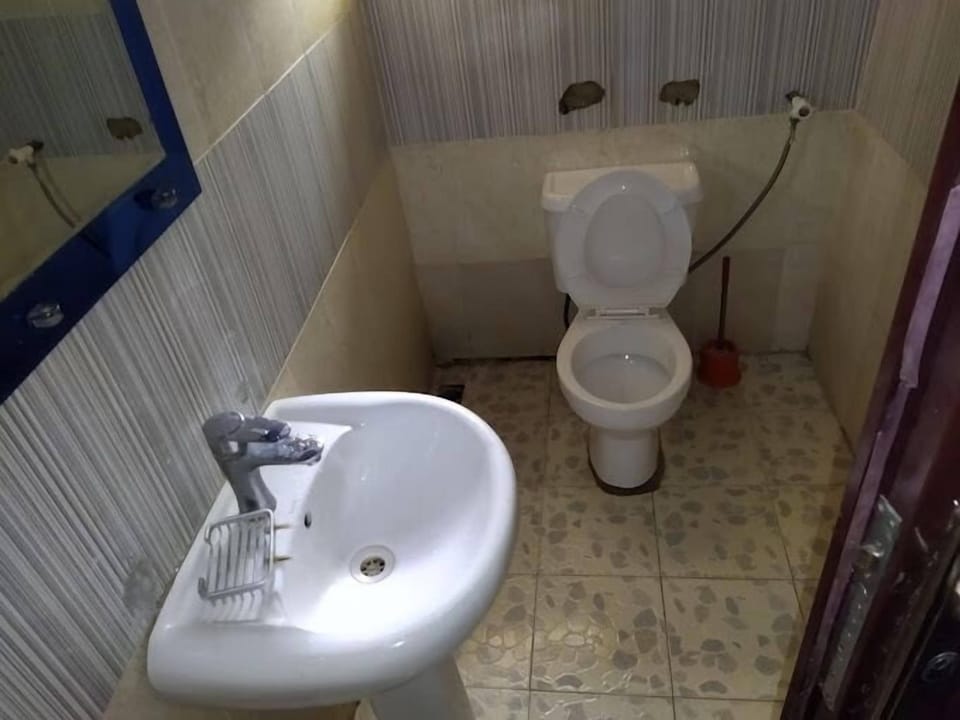 Economy Room, Balcony, City View | Bathroom | Free toiletries, hair dryer, towels, soap