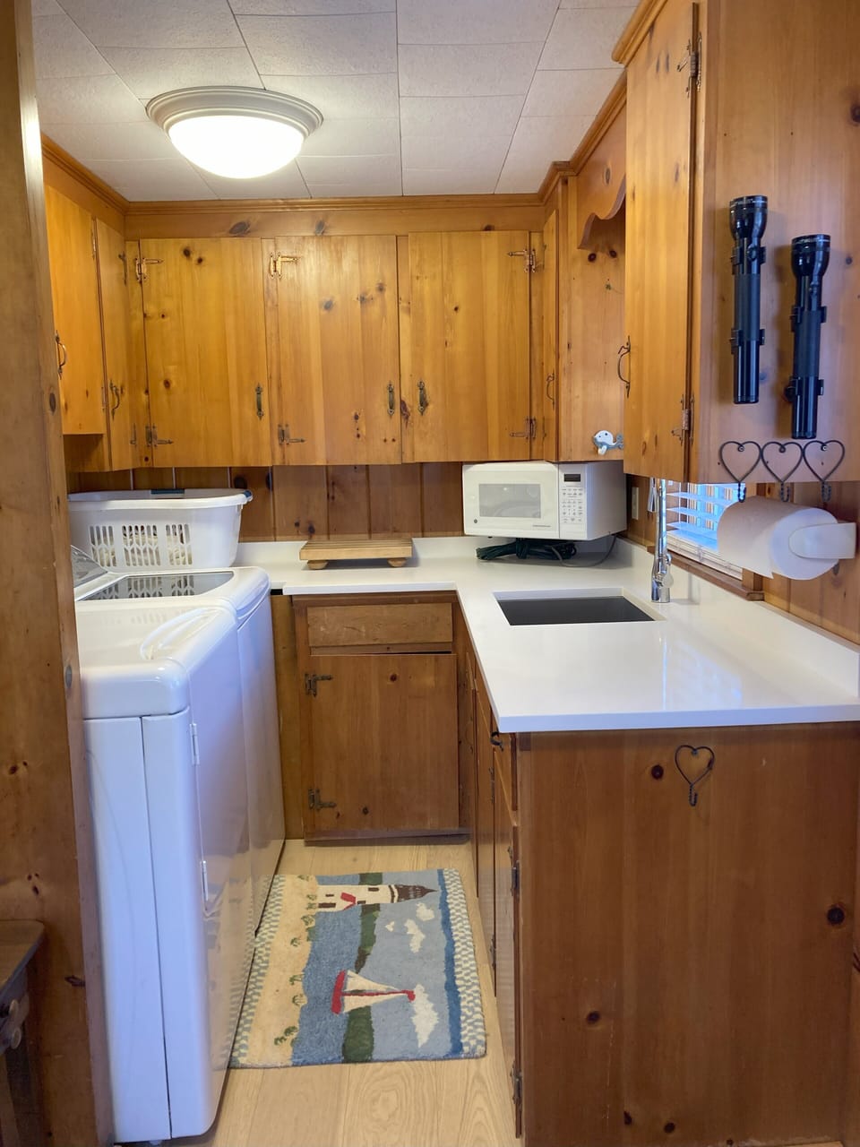 Rear pantry with sink, microwave, small fridge, laundry and separate entrance.