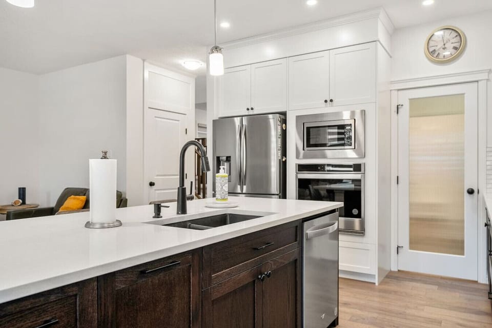 Full kitchen on the main floor with a drip coffee maker & a blender.