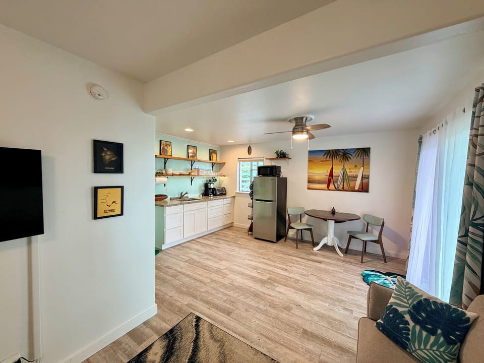 From love seat looking toward tv, kitchen and dining area