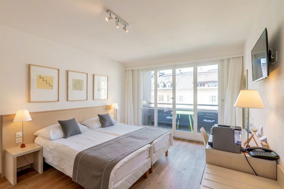 Premium bedding, desk, laptop workspace, free WiFi