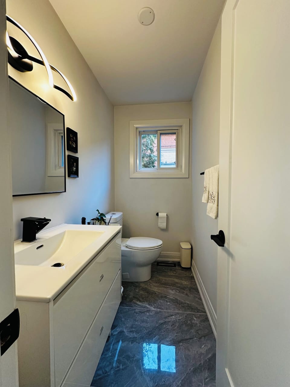 Stylish Main Floor Half Bathroom:
filled with Natural Light and Fresh Air