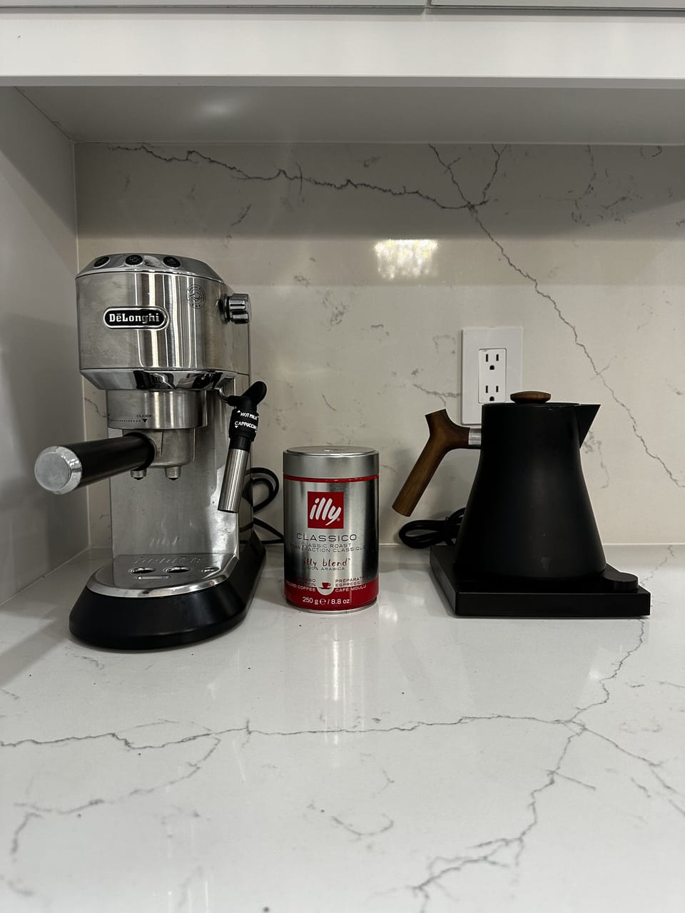 A De'Longhi espresso maker and complimentary coffee await your mornings.