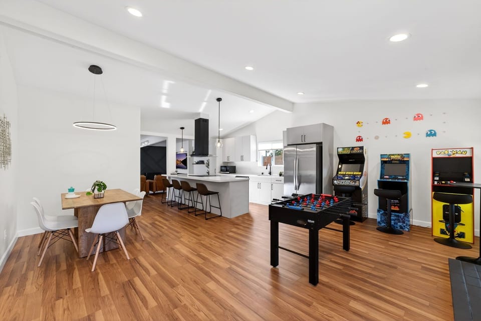 Game area includes 3 arcade machines, foosball, and 60" smart TV